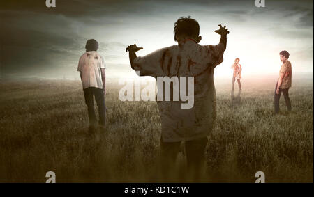 Group of scary asian zombies walking around against dramatic sky background Stock Photo