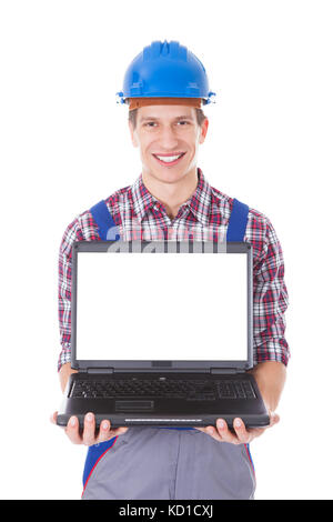 Portrait Of Male Architect Holding Laptop Over White Background Stock Photo