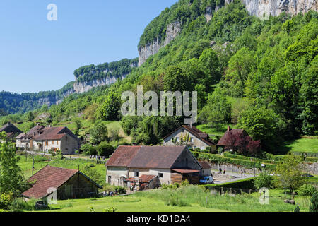 The village of Baume-les-Messieurs lies within the most extensive of the steephead valleys of the Jura escarpment, the 'Reculee de Baume', limestone c Stock Photo