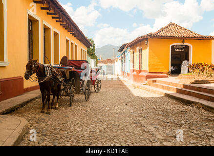 Horse and cart on the colourful cobblestone streets, Trinidad,  Sancti Spíritus, Cuba,Caribbean Stock Photo