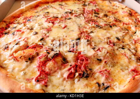 picture of a Fresh baked pizza in macro view Stock Photo