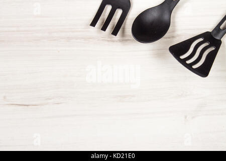 kitchenware on wooden background with empty place Stock Photo