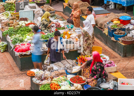 Malay Muslim women operate the fresh produce stalls in the Central Market of Kota Bharu in Kelantan State, northeast Malaysia Stock Photo