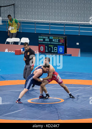 Baku, Azerbaijan - May 18, 2017 : Greco Roman wrestling 85kg bronze medal final at 4th Islamic Solidarity Games, Baku, Azerbaijan Stock Photo