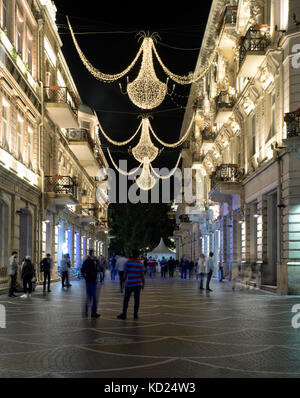 Baku, Azerbaijan - May 18, 2017 : Nizami street in the city center illuminated by night. Stock Photo