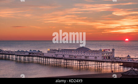 View of a sunset on the beach in Brighton Stock Photo