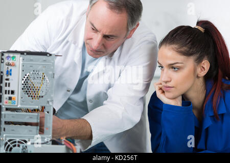 student in electrical engineering course training with teacher Stock Photo