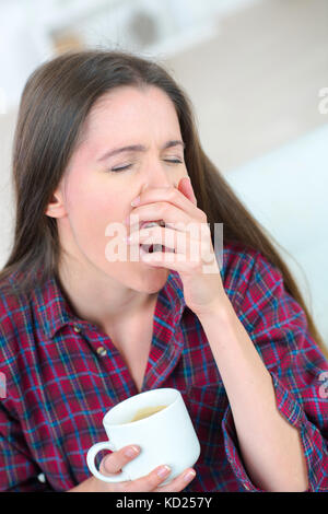 young woman yawning Stock Photo
