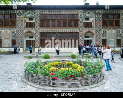 Tourists taking photos in front of 18th century Palace of Shaki Khans, Sheki, Azerbaijan Stock Photo