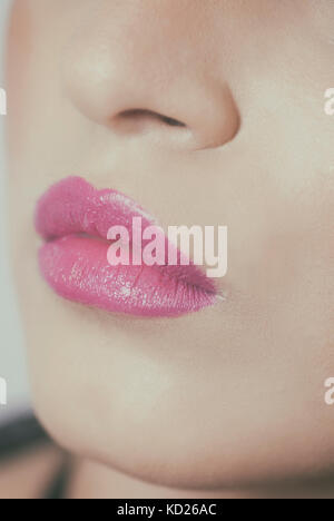 Close up of a woman's lips wearing lipstick Stock Photo
