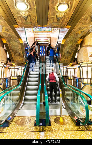Escalator, using Escalator, people using Escalator, riding Escalator, shop Escalator, store Escalator, Escalators, Escalator inside store, up & Down Stock Photo