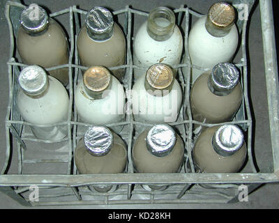 vintage milk bottles in a vintage container Stock Photo