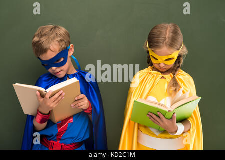 superheroes reading books Stock Photo