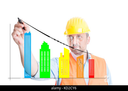 Male engineer writing on screen with different buildings type Stock Photo