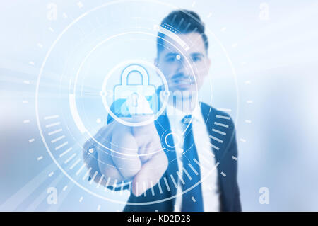 Businessman press shield lock on virtual screen  as safety app privacy concept Stock Photo