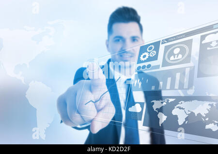 Successful businessman touching with finger virtual panel with infographs Stock Photo
