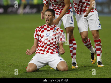 Kiev, Ukraine. 9th Oct, 2017. Croatian players celebrate after Andrej Kramaric (down) scored a goal during the 2018 FIFA World Cup qualifying soccer match between Ukraine and Croatia at the Olimpiyskyi stadium in Kiev, Ukraine, 09 October 2017. Credit: Serg Glovny/ZUMA Wire/Alamy Live News Stock Photo