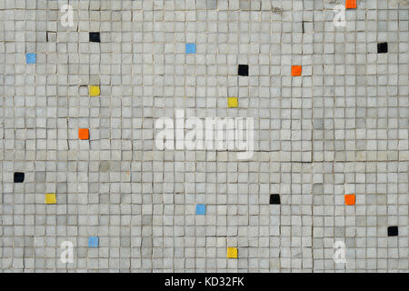 gray tiled mosaic wall with random color pattern background Stock Photo