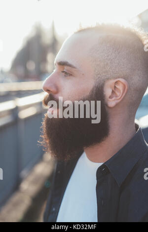 Side view portrait of bearded man looking away Stock Photo
