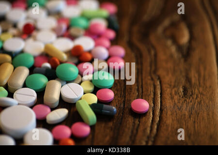 Multicolored tablets of different shapes and sizes Stock Photo