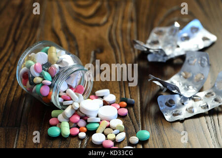 Multicolored tablets of different shapes and sizes Stock Photo