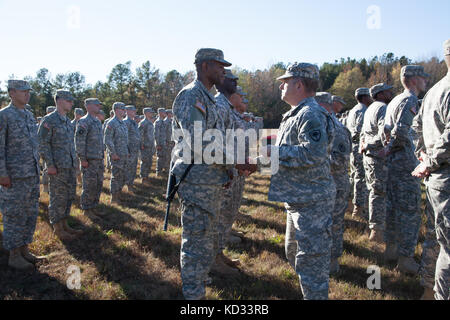 U.S. Army Maj. Gen. Robert E. Livingston Jr., Adjutant General for South Carolina, recognizes North Carolina Army National Guard Soldiers who supported the South Carolina flood response and recovery efforts in October during a ceremony at Camp Butner, N.C., Nov. 14, 2015. South Carolina experienced unprecedented flooding throughout many areas of the state in October due to historic rainfall. (U.S. Army National Guard Photo by Capt. Brian Hare/Released) Stock Photo