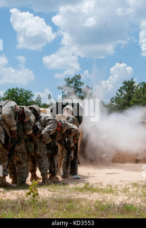 U.S. Army SAPPERs, light combat engineers, from the 1222nd Engineer Battalion, South Carolina Army National Guard, train in multiple mission essential skills during their annual training June 6-20, 2015 at the McCrady Training Center in Eastover, South Carolina. Soldiers shield themselves from a blast detonation during training June 17, 2015.  (U.S. Army National Guard Photo by 2nd Lt. Tracci Dorgan/Released) Stock Photo