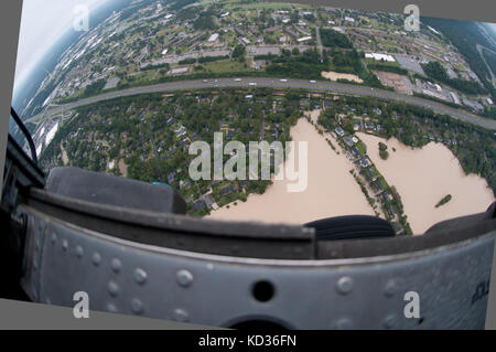 U.S. Soldiers from the 59th Aviation Troop Command, South Carolina Army National Guard (SCARNG), provide airborne support during flood relief operations, Columbia, S.C., October 5, 2015. Over 1,100 South Carolina National Guard members have been mobilized since S.C. Governor Nikky Haley declared a state of emergency, on October 1, 2015. The airborne component of the SARNG’s relief effort includes the S.C. Helicopter Aquatic Rescue Team (SC-HART), a collaborative effort between the State Rescue Task Force (SC-TF1), under the direction of the S.C. LLR, State Fire Marshal and the SCARNG. (US Army Stock Photo