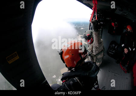 U.S. Soldiers from the 59th Aviation Troop Command, South Carolina Army National Guard (SCARNG), provide airborne support during flood relief operations, Columbia, S.C., October 5, 2015. Over 1,100 South Carolina National Guard members have been mobilized since S.C. Governor Nikky Haley declared a state of emergency, on October 1, 2015. The airborne component of the SARNG’s relief effort includes the S.C. Helicopter Aquatic Rescue Team (SC-HART), a collaborative effort between the State Rescue Task Force (SC-TF1), under the direction of the S.C. LLR, State Fire Marshal and the SCARNG. (US Army Stock Photo