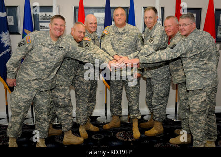 From left Col. Frank Rice, Task Force Tiger Commander, Lt. Col. Marion Collins, Commander, 2-263 Air Defense Artillery (ADA), Maj. Gen. Glenn Bramhall, Commander, 263rd Army Air and Missile Defense Command (AAMDC), Brig. Gen. Van McCarthy, Deputy Adjutant General of South Carolina, S.C. State Command Sgt. Maj. Robert Brickley, Command Sgt. Maj. Russell Vickery, Command Sergeant Major 2-263 Air Defense Artillery (ADA), Command Sgt. Maj. James Hooten, and Task Force Tiger Command Sgt. Major participate in a Battle Handover Ceremony for the National Capital Region Integrated Air Defense System Gr Stock Photo