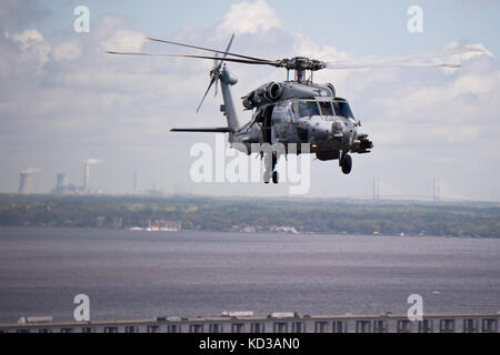 U.S. Army AH-64D Apaches assigned to 151 Attack Reconnaissance Battalion, South Carolina Army National Guard, and U.S. Navy HH-60H Seahawk assigned to Helicopter Anti Submarine Squadron 11 conduct joint training at Naval Air Station Jacksonville, Fla., March 11 and 12.  The units trained on anti surface warfare and combat search and rescue, in preparation for the squadron’s helicopter advance readiness program evaluation. (U.S. Air National Guard photo by Tech. Sgt. Jorge Intriago/Released) Stock Photo