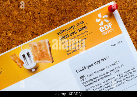 An EDF Energy bill for electricity and gas pinned to a noticeboard ready to pay. Stock Photo