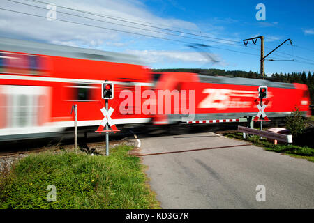 Level crossing with passing train, Andraskreuz, Höllentalbahn, Titisee, Titisee-Neustadt, Black Forest, Baden-Württemberg Stock Photo