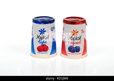 Unopened Pots of mountain blueberry Yoplait original Yogurt and red raspberry Yoplait Light yogurt on white background, cutout USA Stock Photo