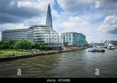LONDON, ENGLAND - JUNE 17, 2016: Wide angle picture showing the City Hall, The Shard,  PriceWaterhouseCoopers buildings, a part of the River Thames wi Stock Photo