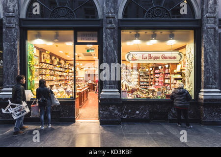 BRUSSELS BELGIUM - JUNE 18 2016: Horizontal picture of a chocolate store located inside the Galerie de La Reine with people looking into the store. Br Stock Photo