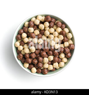 Breakfast cereal balls in bowl. Tasty breakfast. Chocolate cereals. Stock Photo