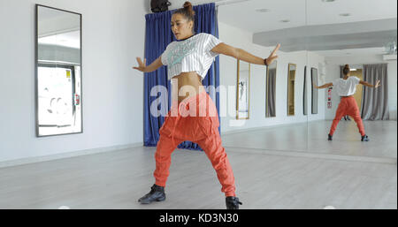 Expressive woman dancing in studio Stock Photo