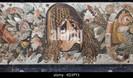 Naples. Italy. Roman mosaic (2nd century B.C.) with theatrical mask and festoon with leaves and fruit (detail), from the Casa del Fauno, Pompeii. Stock Photo