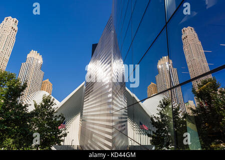Glass reflection of the Oculus and skyscrapers at the 9/11 Memorial & Museum. Lower Manhattan, Financial District, Manhattan, New York City Stock Photo