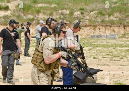 Men shooting outdoors Stock Photo