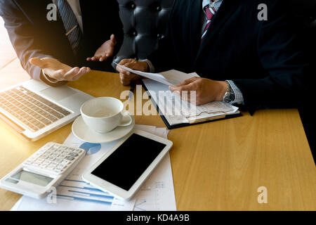 businessman talk and Discussion about business project on table with tablet screen clipping path Stock Photo