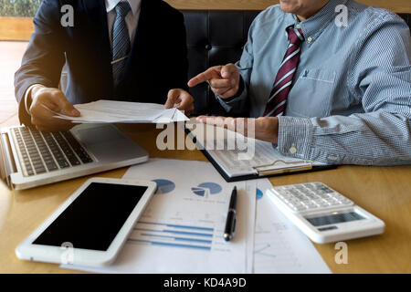 businessman talk and Discussion about business project on table with tablet screen clipping path Stock Photo