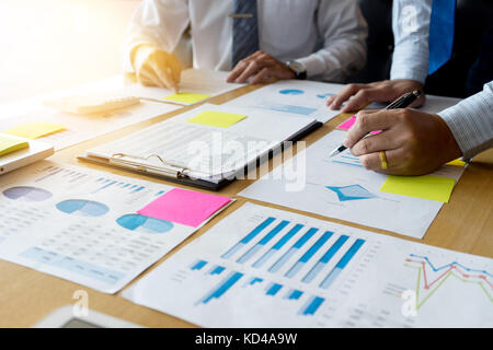 Two businessman working  with graph chart for marketing plan Stock Photo