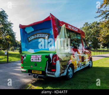 An ice cream van parked outside a childlren's play area, on a warm, sunny morning in early autumn, in Gunnersbury Park, West London, W3, England, UK. Stock Photo