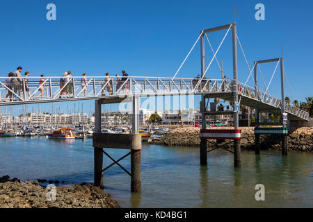 LAGOS, PORTUGAL - SEPTEMBER 10TH 2017: A view of the pedestrian drawbridge at the Marina de Lagos in the Algarve, Portugal, on 10th September 2017. Stock Photo