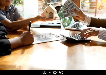 Businessman and customer sign to the contract real estate in buy loan finance and  insurance Stock Photo