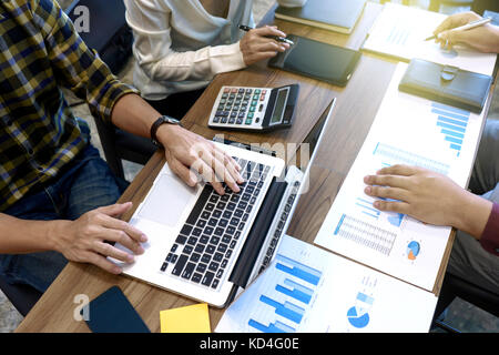 Group of business man and woman discussing on the table about startup business in vintage tone Stock Photo