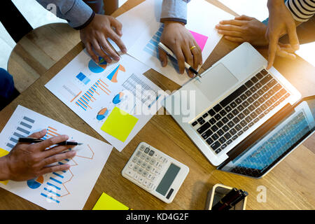 business team man and woman work with laptop on wood table Stock Photo