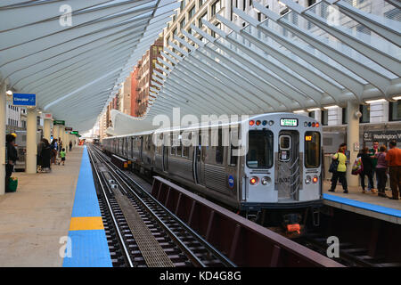 The modern downtown 'L' train station at Washington and Wabash provides a fitting entry for tourists visiting Millennium Park in Chicago. Stock Photo